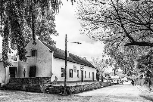 Wupperthal, South Africa, August 27, 2018: The Moravian Mission Store in Wupperthal in the Cederberg Mountains of the Western Cape Province. People are visible. Monochrome