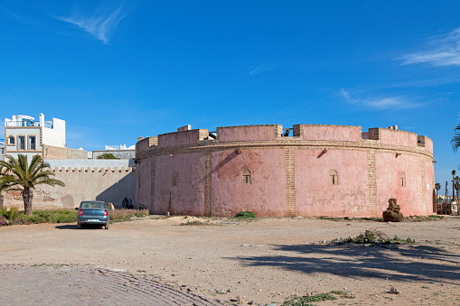 Essaouira, Morocco - January 29 2019: Borj Bab Marrakech is the most important defensive building on the land side. It is in the form of a large circular tower 35 m in diameter and occupies an area of approximately 980 m², designed to house a dozen cannons spread over an angle of 270 °, thus dominating most of the eastern entrances of the medina.