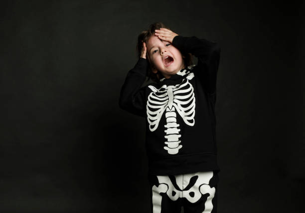 istock Cute baby boy in skeleton costume 1131192880