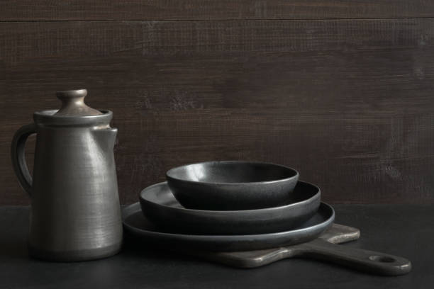 istock Crockery, clayware, dark utensils and stuff on dark tabletop. Kitchen still life. 1131194203