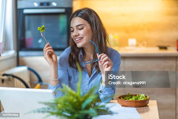 Young Business Woman Eating Salad At Home Stock Photo - Download Image Now - Eating, One Woman Only, Women