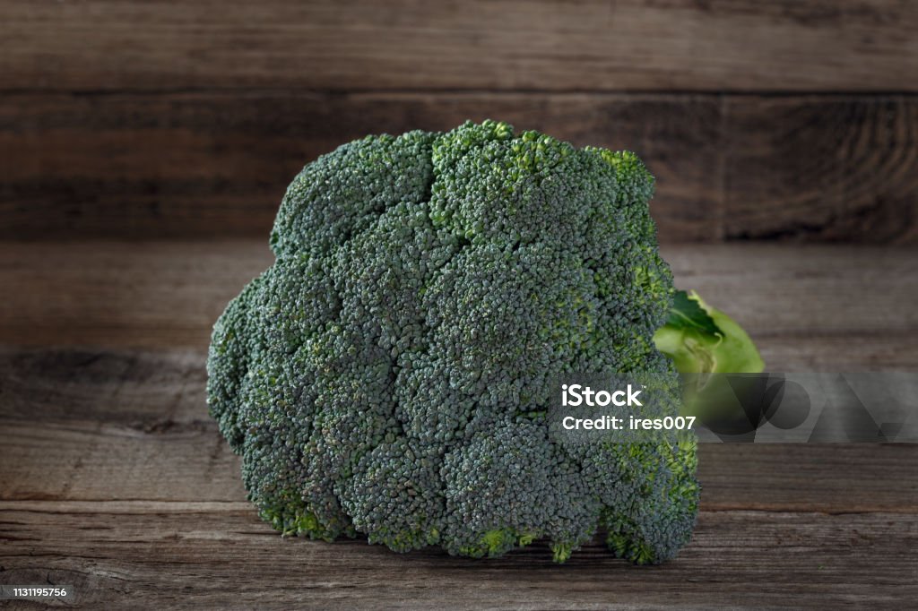 Fresh broccoli on wooden background Fresh broccoli on a wooden background, green Abstract Stock Photo