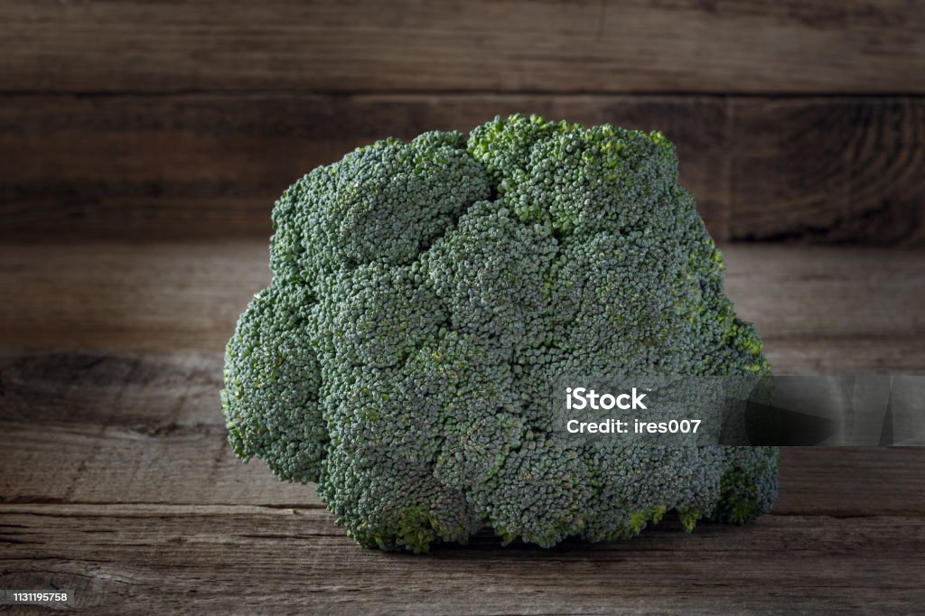 Fresh broccoli on wooden background Fresh broccoli on a wooden background, green Abstract Stock Photo