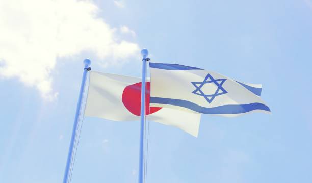 istock Japan and Israel, two flags waving against blue sky 1131196774