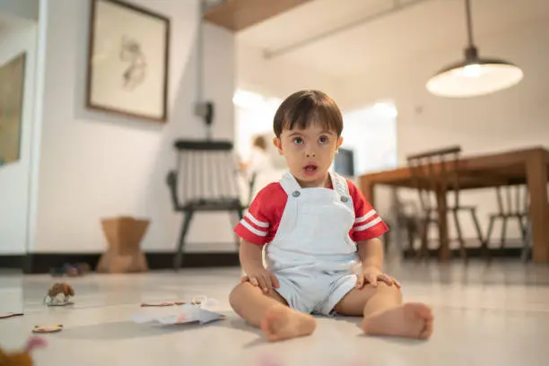 Photo of Down Syndrome Little Boy Playing at Home