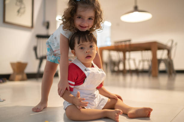 istock Twin Sibling (Down Syndrome Son and Daughter) portrait at home 1131197160