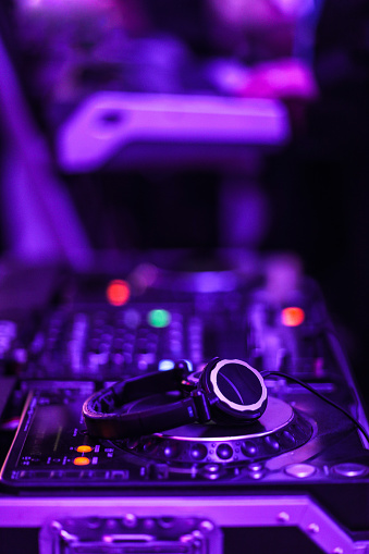 DJ console desk at nightclub ,with headphones