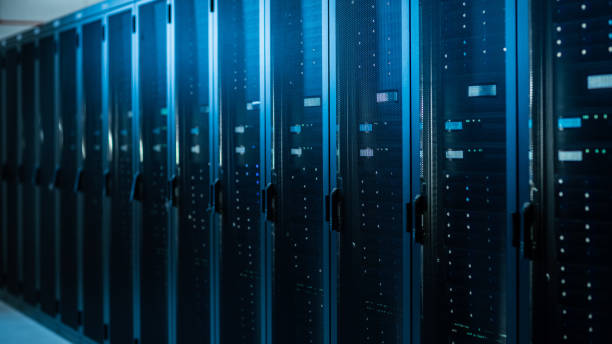 istock Shot of a Working Data Center With Rows of Rack Servers. Led Lights Blinking and Computers are Working. 1131198111