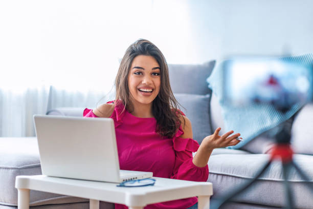 istock Friendly woman internet teacher tutor looking at camera talking. 1131198353