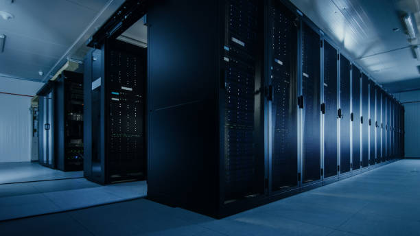 istock Shot of a Working Data Center With Rows of Rack Servers. Led Lights Blinking and Computers are Working. 1131198406