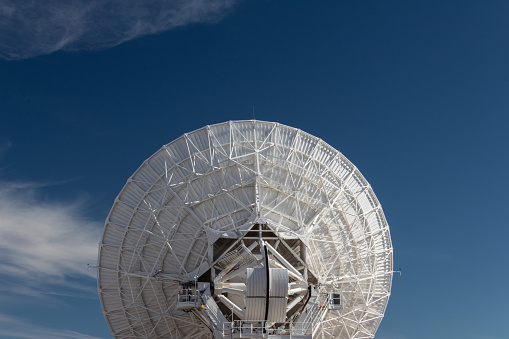Very Large Array centered rear view of radio astronomy observatory dishes, science technology, copy space, horizontal aspect