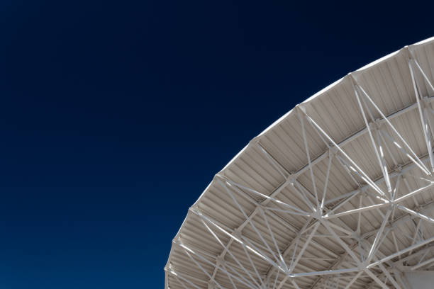 istock Very Large Array expanse of deep blue sky with radio telescope satellite dish, science technology 1131201477