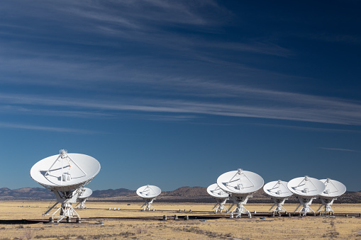 Very Large Array of radio astronomy observatory dishes in the New Mexico desert, space exploration, science technology, horizontal aspect