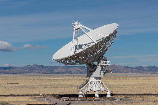 Very Large Array radio astronomy observatory dish, engineering science technology, blue sky, horizontal aspect