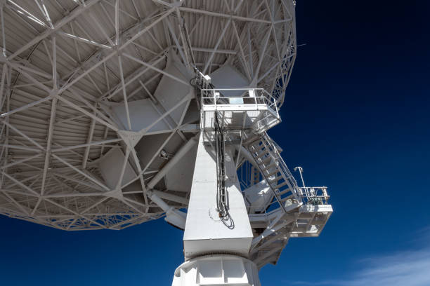 istock Very Large Array upright and trusses under radio astronomy observatory dish against blue sky, science technology engineering 1131201889