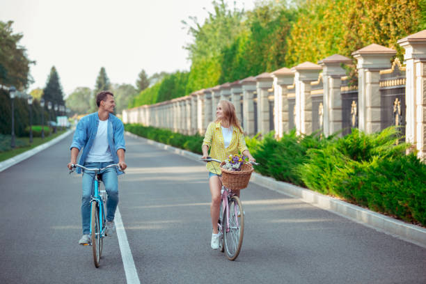 istock Couple riding bicycle together active lifestyle concept 1131201959