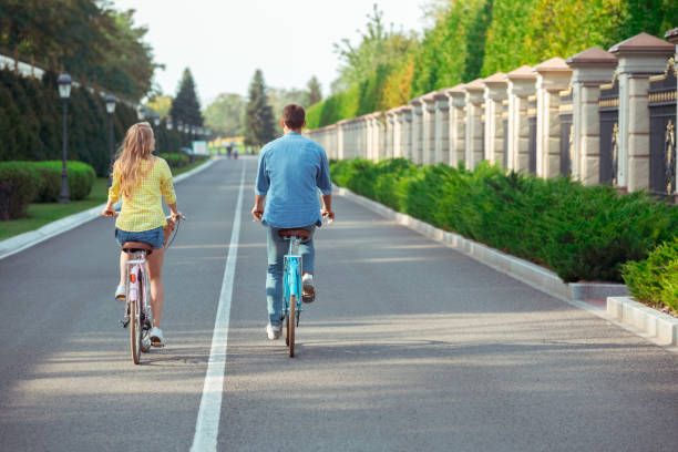 istock Couple riding bicycle together active lifestyle concept 1131201965