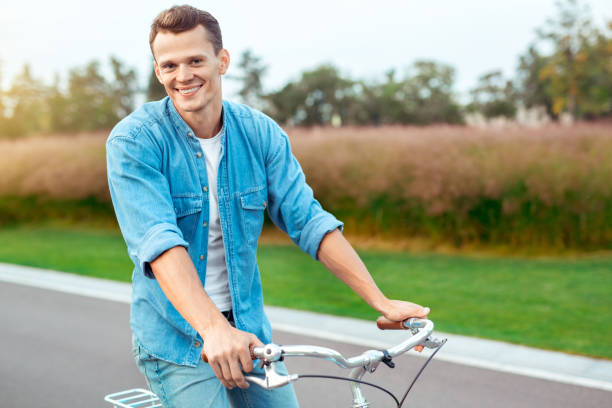 istock Young man riding a bicycle healthy lifestyle concept 1131202049