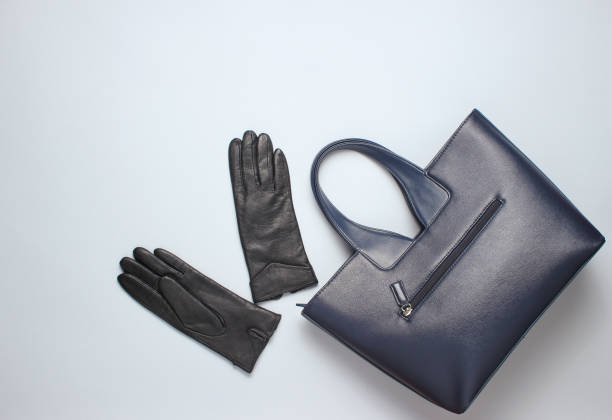 istock Leather bag, gloves on a gray background. Top view, minimalism 1131203520