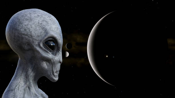 Illustration of a gray alien in the foreground with planets and moons in the background. 3d illustration of a gray alien in the foreground with planets and moons in the background. alien grey stock pictures, royalty-free photos & images