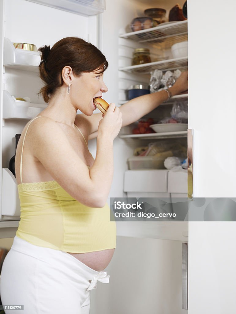 pregnant woman eating sandwich  Pregnant Stock Photo