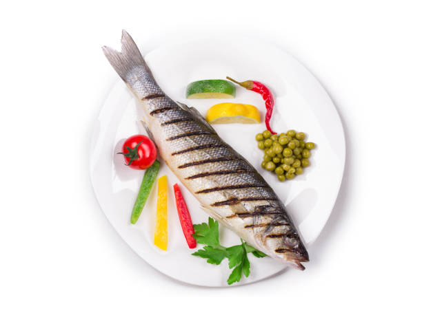 istock Grilled seabass on plate with mushrooms. 1131208779