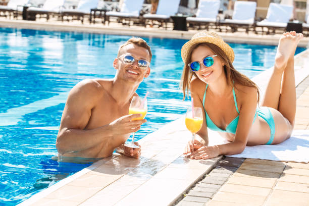 istock Young couple active leisure swimming pool concept 1131212598