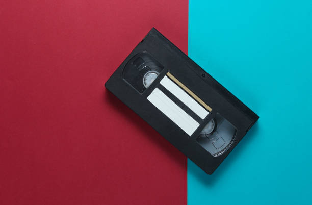 istock Retro video cassette on a red-blue background. Top view 1131212756