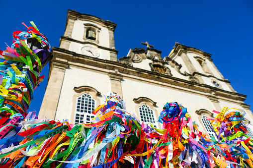 Igreja de Nosso Senhor do Bonfim, a catholic church located in Salvador, Bahia in Brazil during blue summer season. Famous touristic place where people make wishes while tie the ribbons in front of the church. 02/10/2019