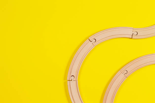 istock Wooden rails on yellow background. Top view 1131215743