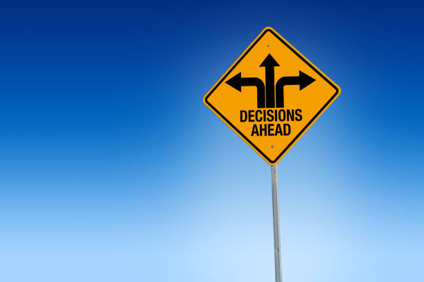 descisions ahead road sign in warning yellow with blue background, - illustration - harsh conditions imagens e fotografias de stock