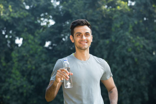 istock Photo of a young man drinking water - Stock image 1131217921