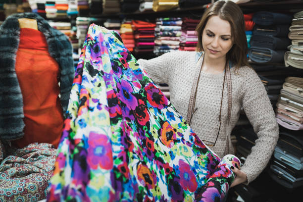 istock Young female entrepreneur designing clothes in the design studio 1131221907