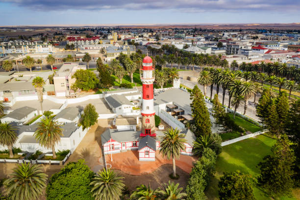 Swakopmund Cityscape with Lighthouse Aerial View Namibia Aerial view of Swakopmund Town Center with famous colonial Swakopmund Lighthouse. Drone point of view. Swakopmund, Namibia, Africa swakopmund photos stock pictures, royalty-free photos & images
