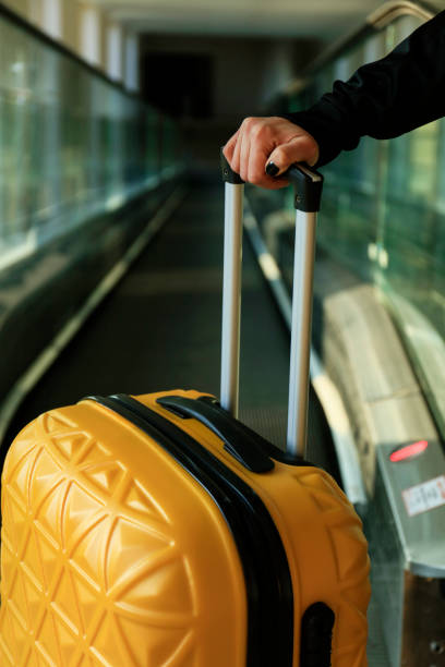 istock Carrying hold suitcase in the airport. 1131227688