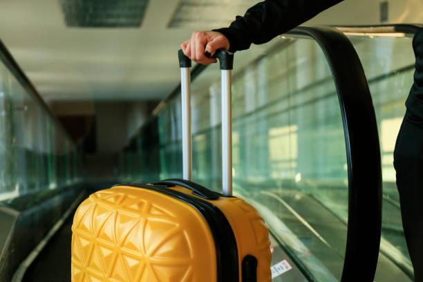 istock Carrying hold suitcase in the airport. 1131228282