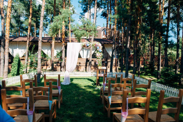 istock Wedding arch decorated with flowers in the forest 1131228500