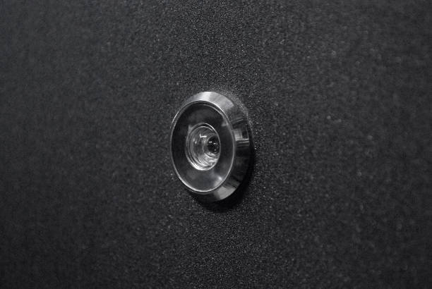 istock Peephole On Dark Blue Metal Door 1131230184