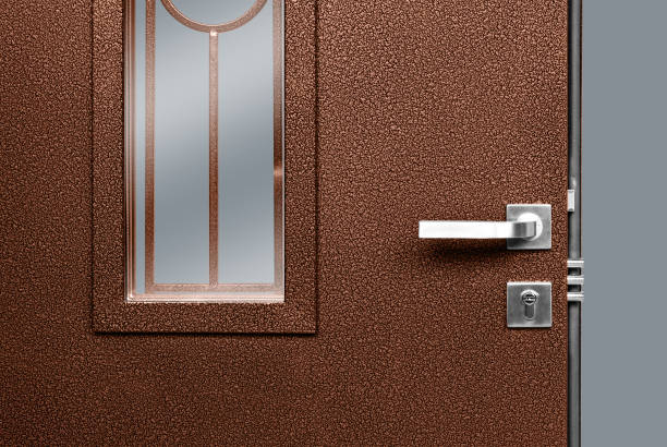 istock Peephole On Brown Metal Door With Handle And Lock 1131230208