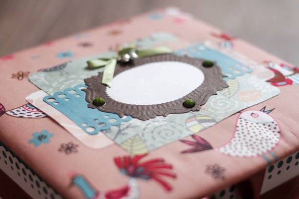 Colorful casket handmade. Cloth multicolored Colorful casket handmade. Cloth multicolored cover with a window for inscription. macro photography. view from above. child casket stock pictures, royalty-free photos & images
