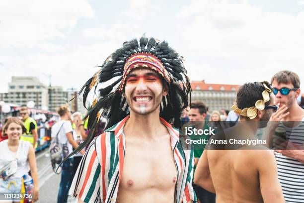 People At The Annual Prague Gay Pride Parade Man In A Native American Costume Smiling Stock Photo - Download Image Now