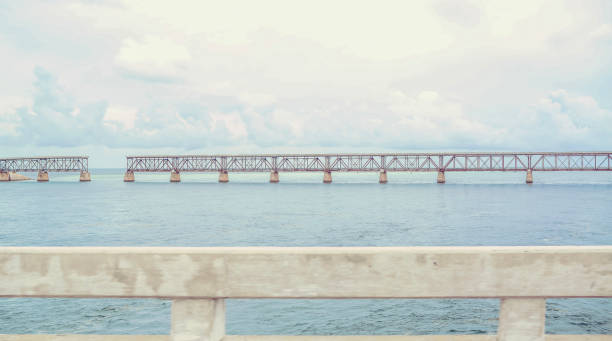 A gap in the old bridge connecting two islands in the Florida keys. A scenic ocean scene in coastal tropical USA, Florida.