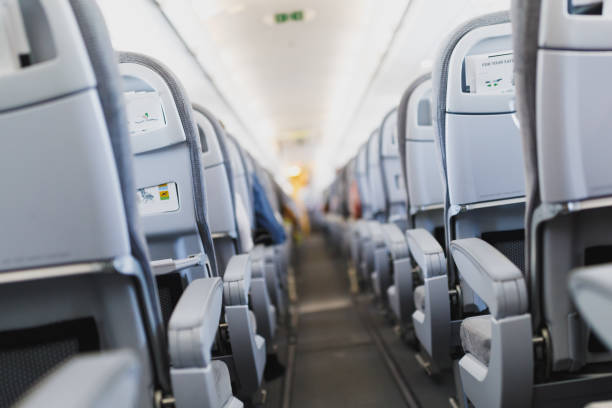 istock airline passenger seats and aisle 1131235940