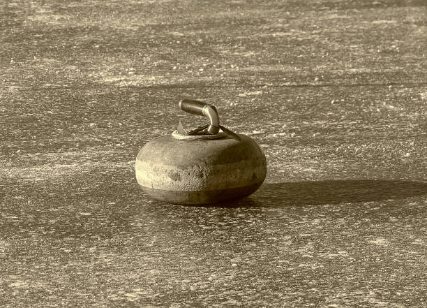 istock A single curling stone on a frozen pond 1131236798