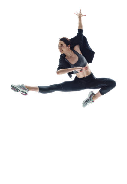 istock Beautiful athletic woman dancing in midair 1131242090