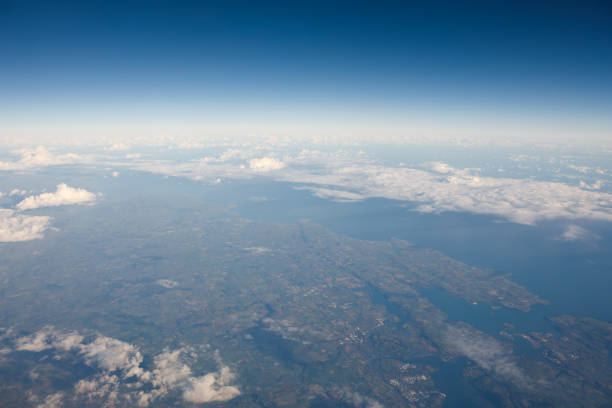 istock view of England from side window of airplane 1131243324
