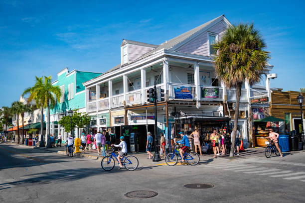 Tourist, including several on rental bicycles, at the corner of Duval and Green Streets in Key West, Florida. (January 4, 2019)