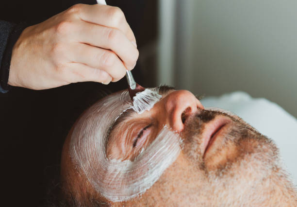 istock Middle-aged man in a spa with a facial mask. 1131256799