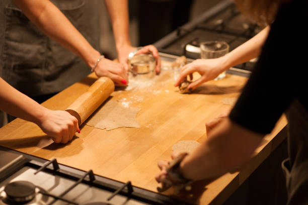 istock High Angle View Of People Making Cookies On Kitchen Counter 1131259429
