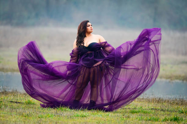 istock Model Waving Purple Tulle Dress 1131259994